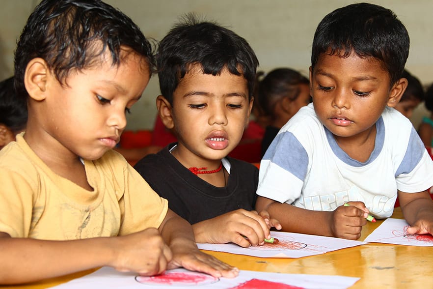 Children focused and learning together in class