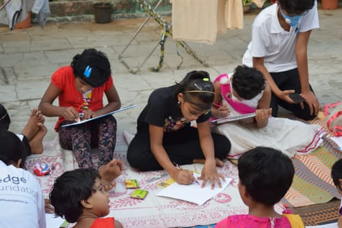 A group of children engaged in outdoor learning activities